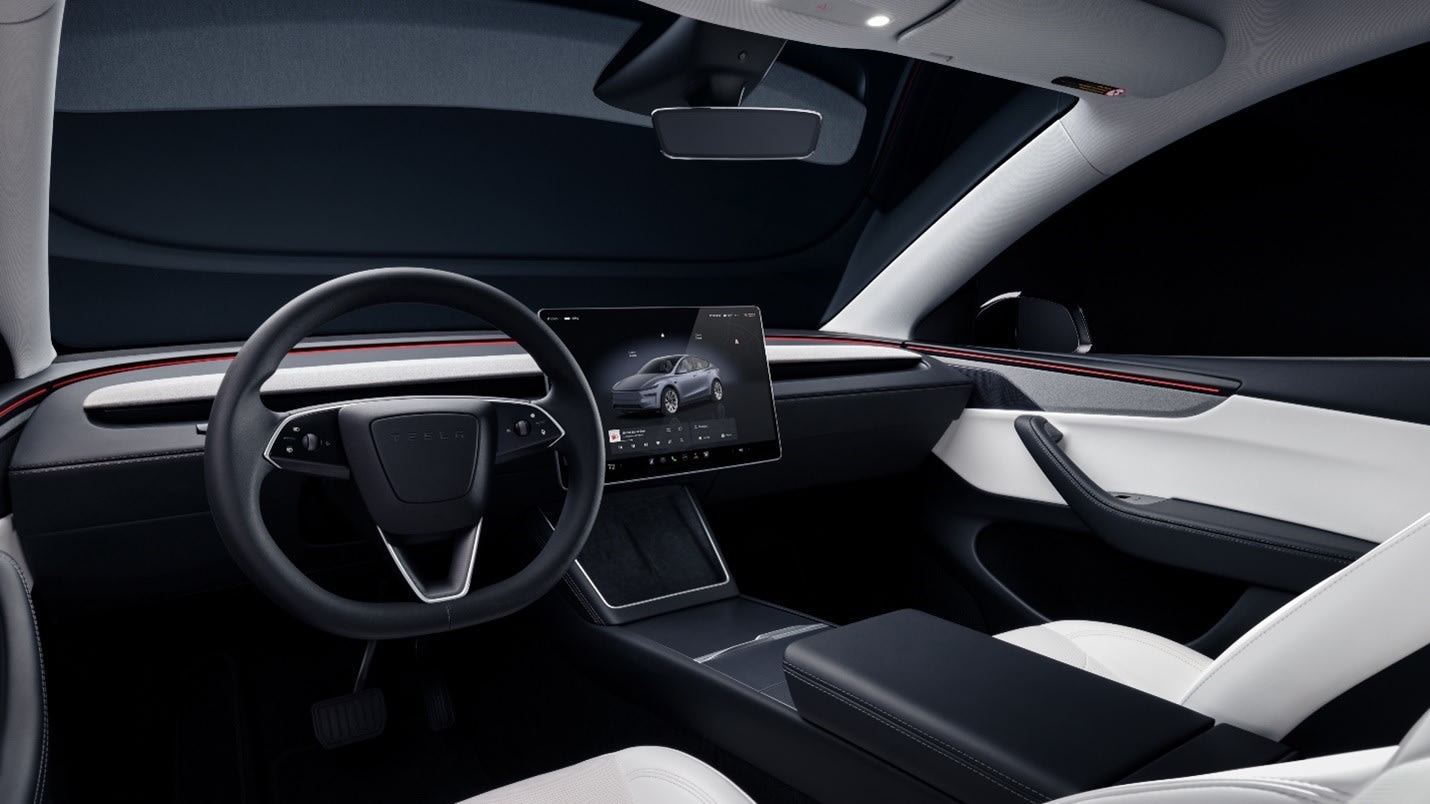 2025 Tesla Model Y Juniper interior dashboard with ambient lighting and 15.4-inch touchscreen